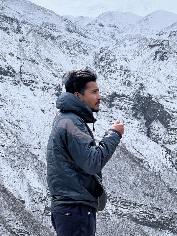 bidur khanal at tilicho base camp drinking tea